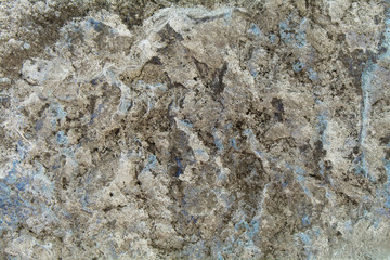 rough wall background with prominent porous patches