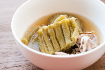 Bitter Gourd Soup with Pork in a Bowl on Wood Table