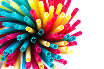 Colored plastic drinking straws on a white background