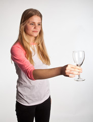 Scandinavian cute young girl with an empty glass