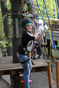 Girl climbing the rope