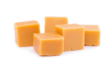 Tasty toffees on a white background.