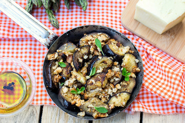 Eggplants aubergines sautéed with breadcrumbs and cheese