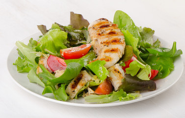 Chicken salad on a white plate.