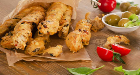 Homemade BreadSticks on  a  rustic wooden board.