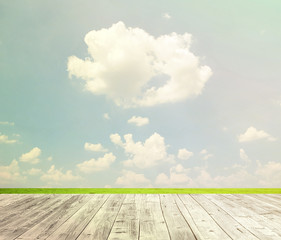 Background with empty wooden table over beautiful meadow