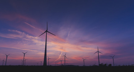 Obraz premium Sunset with Windgenerator