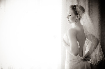 Bride getting ready. beautiful bride in white wedding dress with