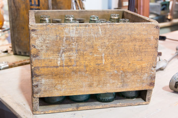 empty bottles in vintage wodden crate