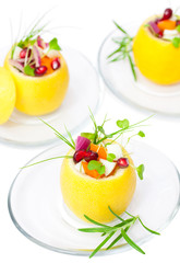 Fototapeta na wymiar isolated stuffed lemons with vegetarian salad