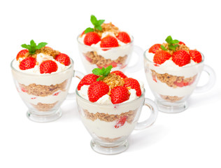 homemade desert with cream chopped cookies and fresh strawberry