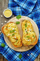 baked pumpkin with millet, vegetables and herbs