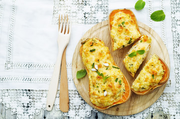 baked pumpkin with millet, vegetables and herbs
