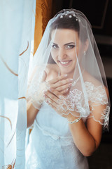 Bride getting ready. beautiful bride in white wedding dress with