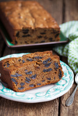 Cake with prunes and almond flour on a wooden table