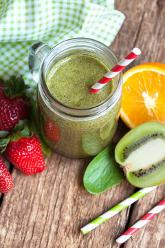 Healthy green smoothie made from spinach, kiwi, strawberries