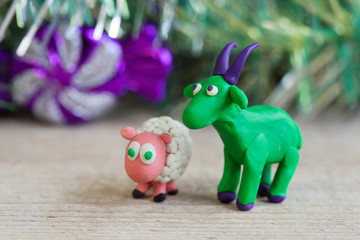 Plasticine world - little homemade green goat with purple horns
