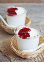 Two small jars homemade yogurt with raspberry jam i