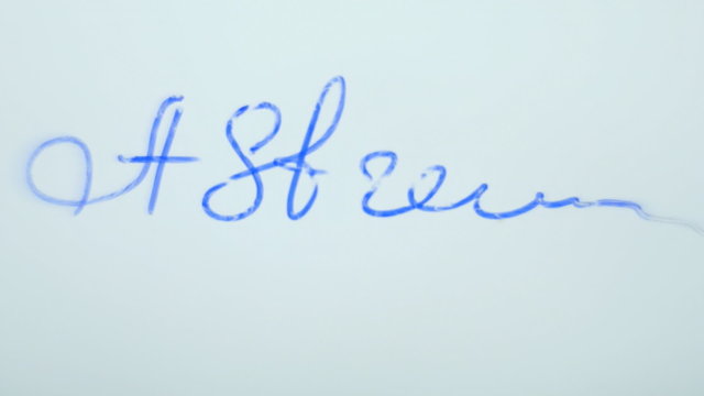 Signature on a transparent surface, a bottom view