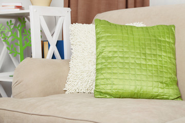 Fototapeta na wymiar Sofa with colorful pillows in room
