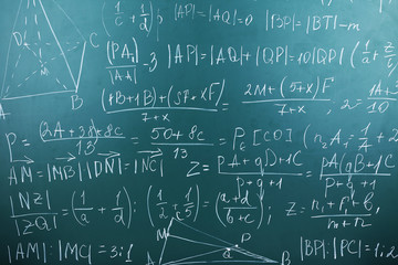 Maths formulas on chalkboard background