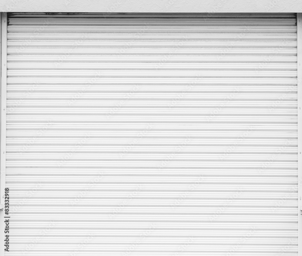 Poster White metal roller door shutter background and texture .