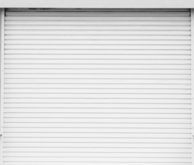 Fototapeta premium White metal roller door shutter background and texture .