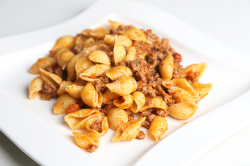 medium shells pasta with bolognese sauce
