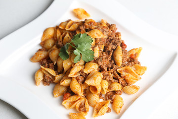 medium shells pasta with bolognese sauce