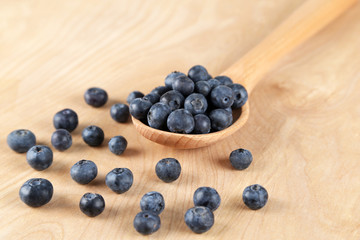 Blueberries in a wooden spoon