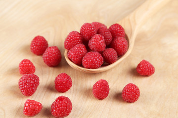 Raspberries in a wooden spoon