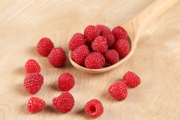 Raspberries in a wooden spoon
