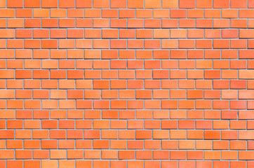 Red brick stone wall seamless background and texture