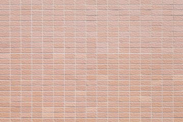 Red brick stone wall seamless background and texture.