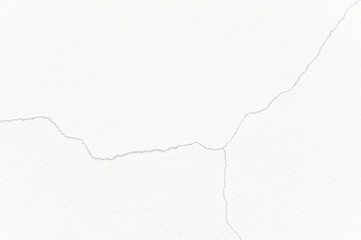 Cracked and broked white cement wall texture and blackground..