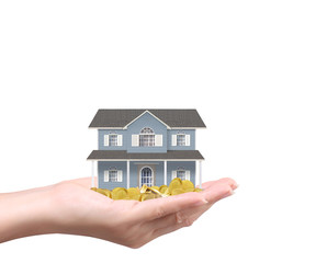 Businessman holding home model and coins