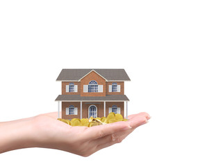 Businessman holding home model and coins