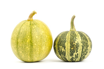 Raw pumpkins on white background