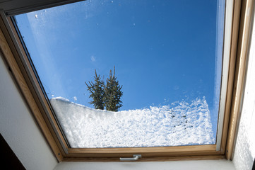 The first snow of the season over the window - obrazy, fototapety, plakaty