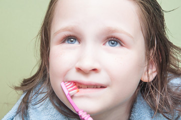 Girl brushing her teeth