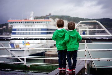 Two smiling little boys on deck of ferry