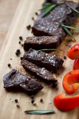 Close-up of well-done grilled machete steak, selective focus