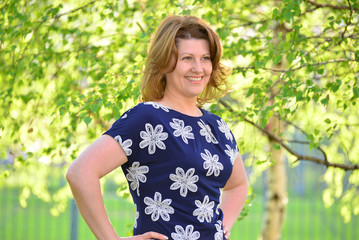 adult elegant woman on the nature in  summer