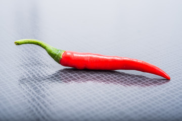 chili pepper on a black texture