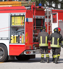 firefighters and fire trucks during an emergency
