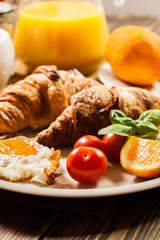Breakfast with croissant end orange juice