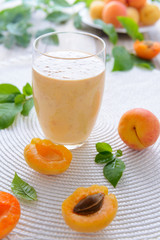 Homenade apricot smoothie and fresh apricots