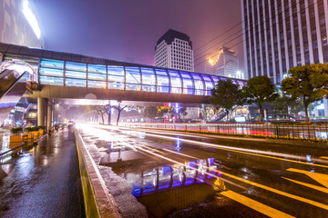 Fototapeta na wymiar Traffic light trails in illuminated city