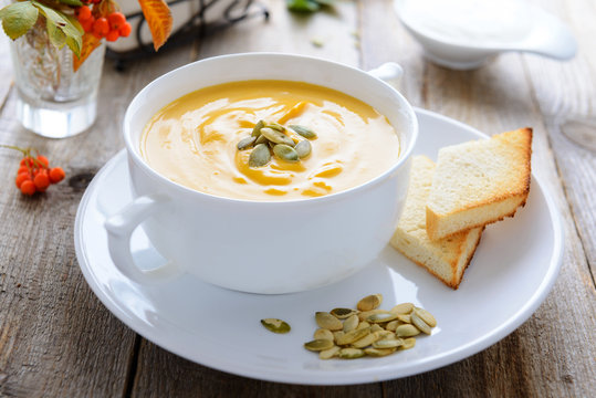 Pumpkin cream soup decorated with seeds