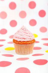 Birthday cupcake with butter cream and candle 